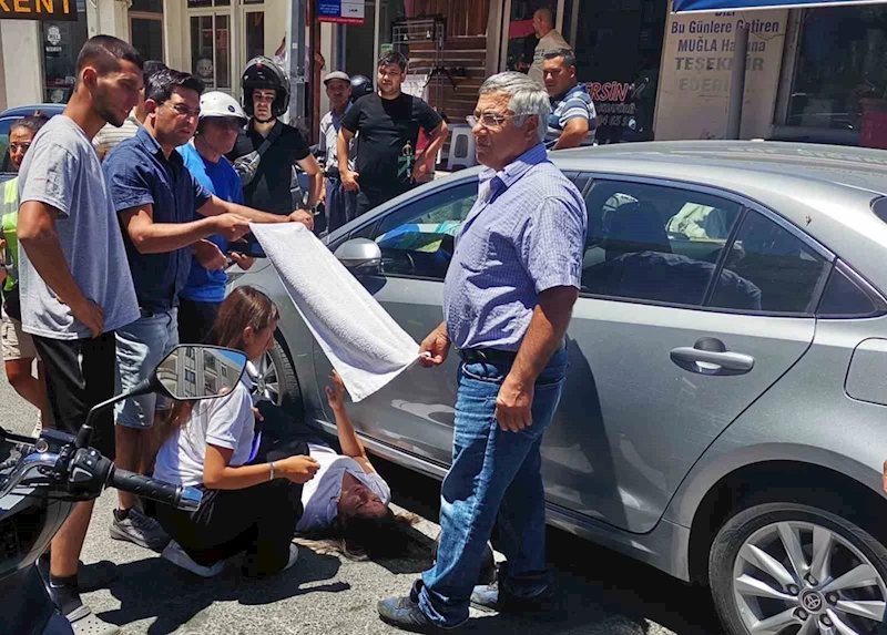 Vatandaşlar yaralı kadın sürücüyü güneşten havluyla korudu
